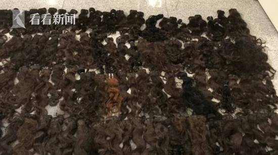 海關(guan) 查獲“瘮人”紙箱 內(nei) 裝370束人體(ti) 毛發